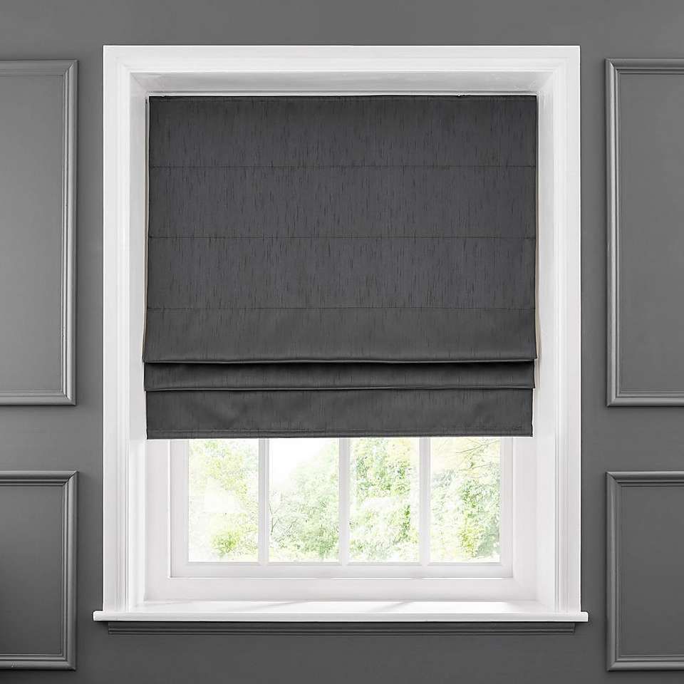 charcoal gray Roman shade on a window.