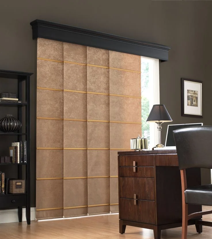 The Panel blinds Dubai are a taupe color with gold accents and have a textured fabric