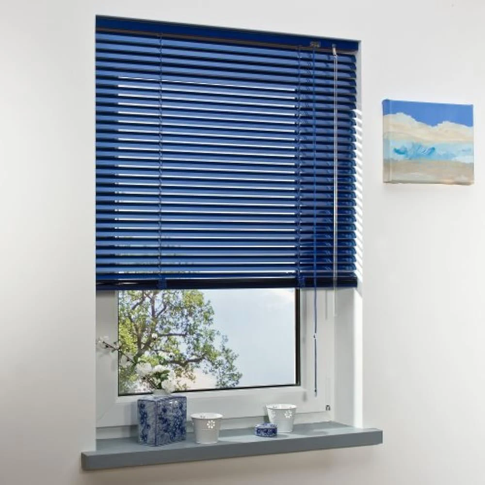 Blue Venetian blinds tilted open in dubai's living room