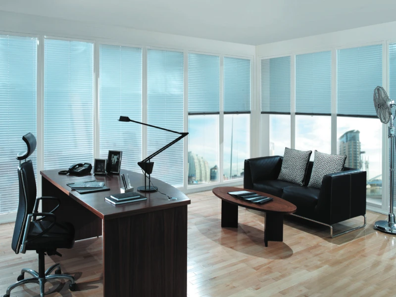 Corporate office interior featuring large windows with blinds