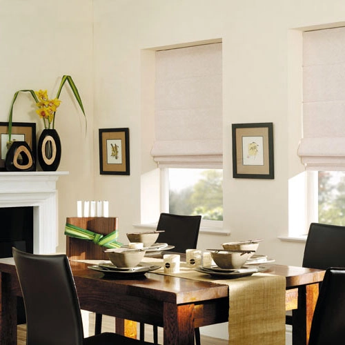 dining room in Dubai with cream Roman blinds and modern wooden decor