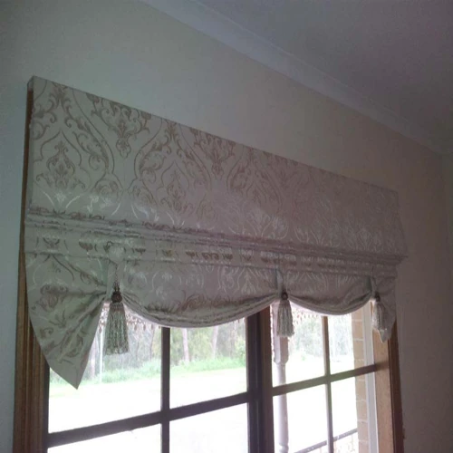 Ornate London or swagged Roman blind with a cream damask pattern
