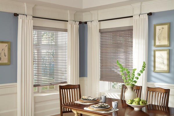 Roman blinds installation in dining room